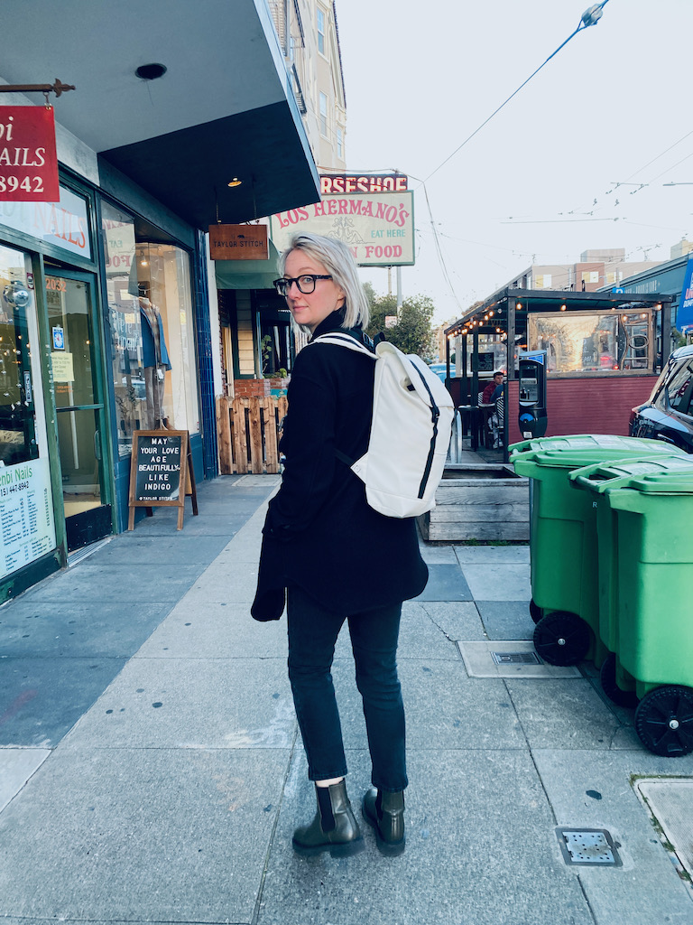 Heather modeling Clare's Eleven Fifteen Daypack on her way home from work