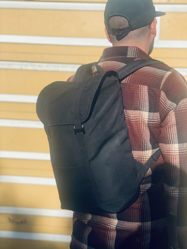 Three quarter view of Eleven Fifteen Daypack on Kevin