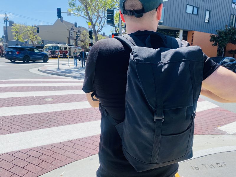 Kevin using the Eleven Fifteen Daypack in black near the Castro in San Francisco