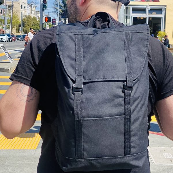 Kevin using the Eleven Fifteen Daypack near Dolores Park